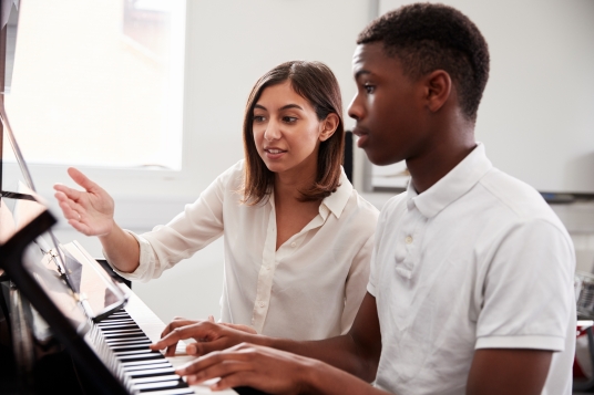 piano student with teacher