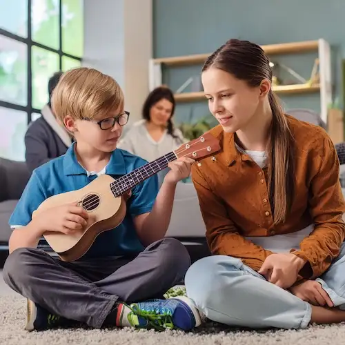 A 11 year old teenager from Atlanta is having ukulele lessons in his apartment with his teacher from Imagine Arts school 11zon